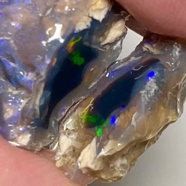 Lightning Ridge knobby opal rough 15.75cts Sun flashes of Multifires sat on black center 20x12x7 & 15x5x4mm NSW090