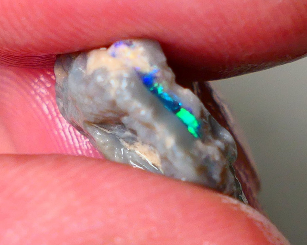 Lightning Ridge Seam opal rough 6.05cts showing Gemmy Very bright consistent flt bar with multi colours to cut worth a gamble on this one cut a gem 16x12x6mm ALP117