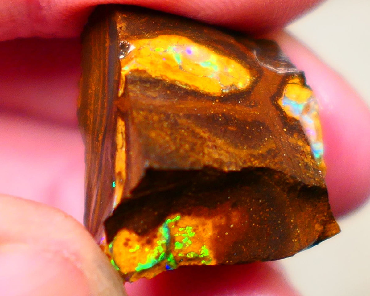 Winton Gem Boulder opal to cut 57.00cts Wonderful Bright & Vibrant Multifires showing on 4 sides time to take the cap off who wants it ? Auction91