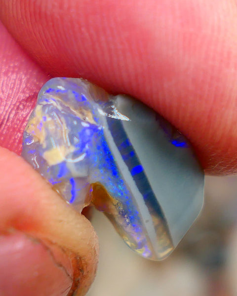 Lightning Ridge Rough Opal 6.00cts Crystal opal carrying fire sat on a bar with blues sat on dark base mother nature hey? Sold as gamble 17x10x7mm Auciton168