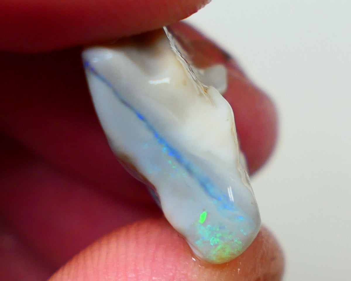 Lightning Ridge Seam opal Dark base 11.75cts Bright Blue bar with some Green fires 19x11x8mm Sold as gamble Auction173