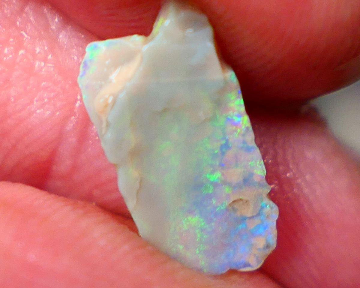 Lightning Ridge Dark base Seam opal 1.95cts Note this is thin So suit inlay/doublet etc Nice Yellow/Blue/Green fires to work with 15x7x3mm GMB-021