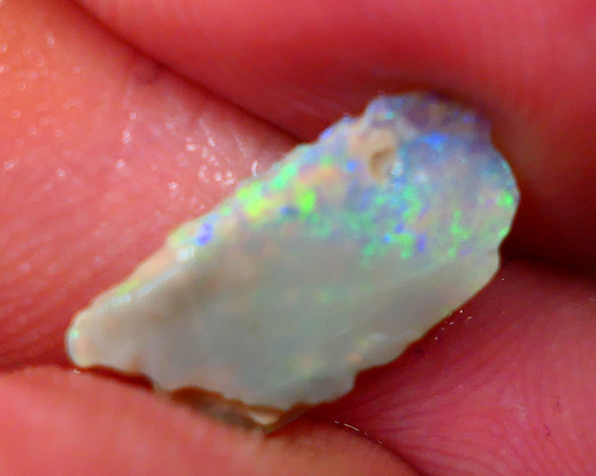 Lightning Ridge Dark base Seam opal 1.95cts Note this is thin So suit inlay/doublet etc Nice Yellow/Blue/Green fires to work with 15x7x3mm GMB-021